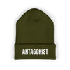 Green beanie with 'ANTAGONIST' text on a white background