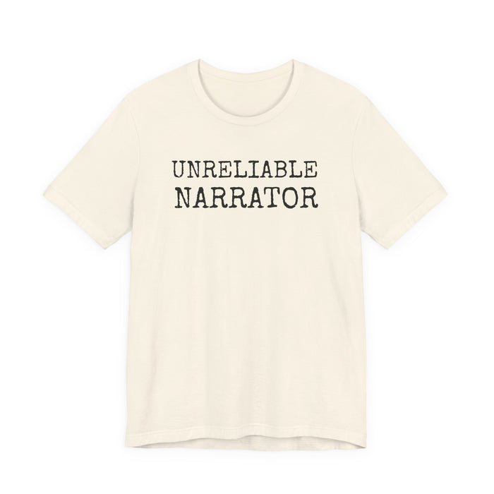 Beige t-shirt with 'UNRELIABLE NARRATOR' text on a white background