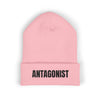 Pink beanie with 'ANTAGONIST' text on a white background