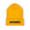 Gold beanie with 'ANTAGONIST' text on a white background
