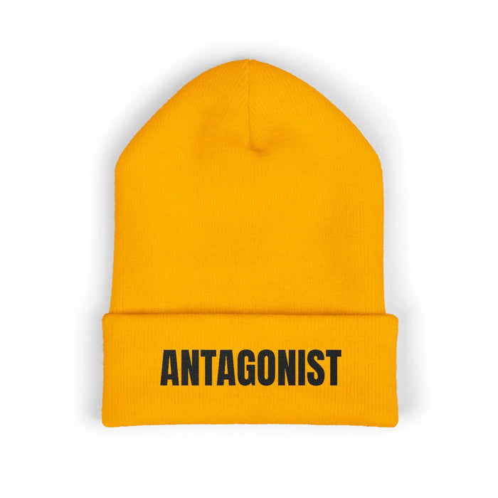 Gold beanie with 'ANTAGONIST' text on a white background