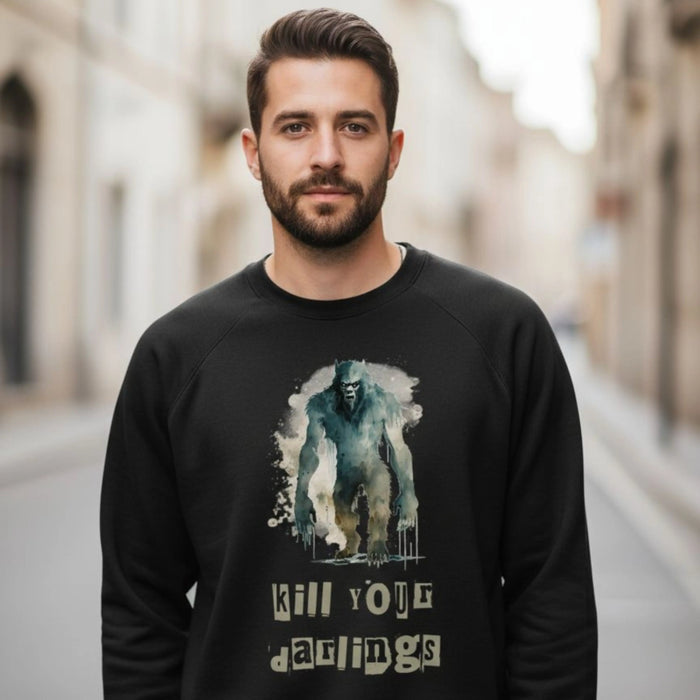 Man wearing a black sweatshirt with a graphic design and text on a city street.